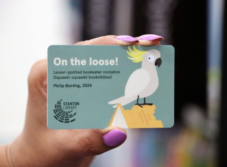 children&#039;s library card featuring a fun cockatoo