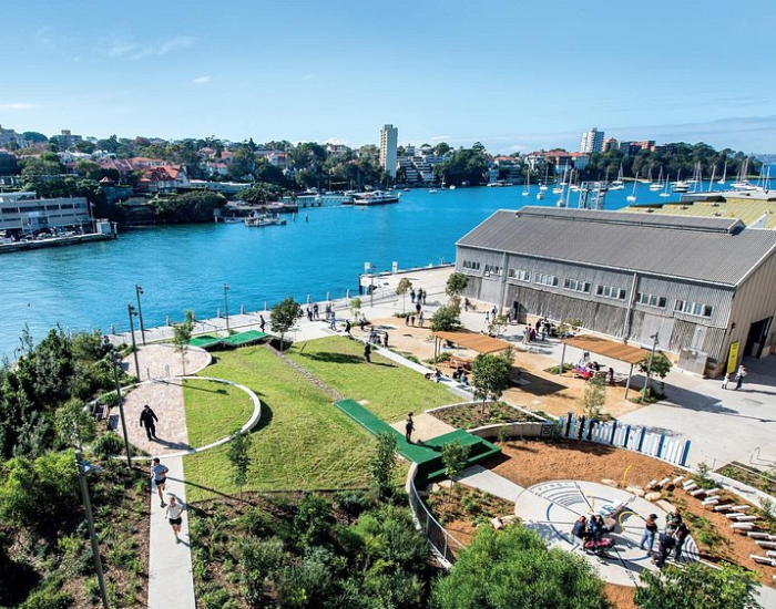 Aerial view of Sun base platypus site with grass and buildings in the foreground and harbour in back