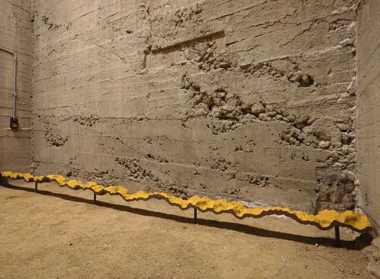 Large yellow Sculpture in centre of room