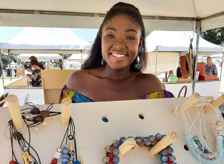 Woman holding her painting