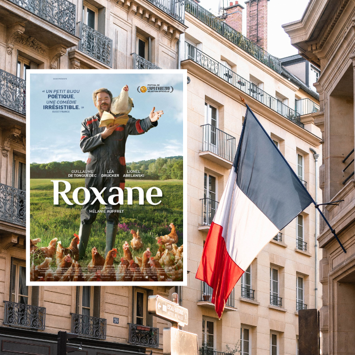 Image of a French flag flying over the streets with the poster image of French movie 'Roxane' on top.