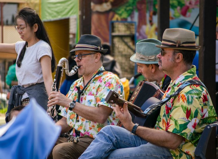 Community centre musicians playing clarinet &amp; guitar