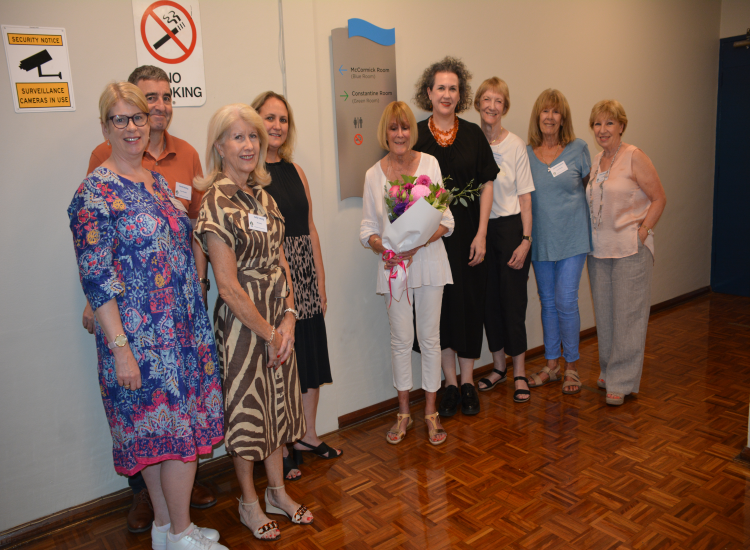 Neutral Bay Community Centre celebrated 50 years with a room naming ceremony. Members pose with the plaque for the upstairs room.