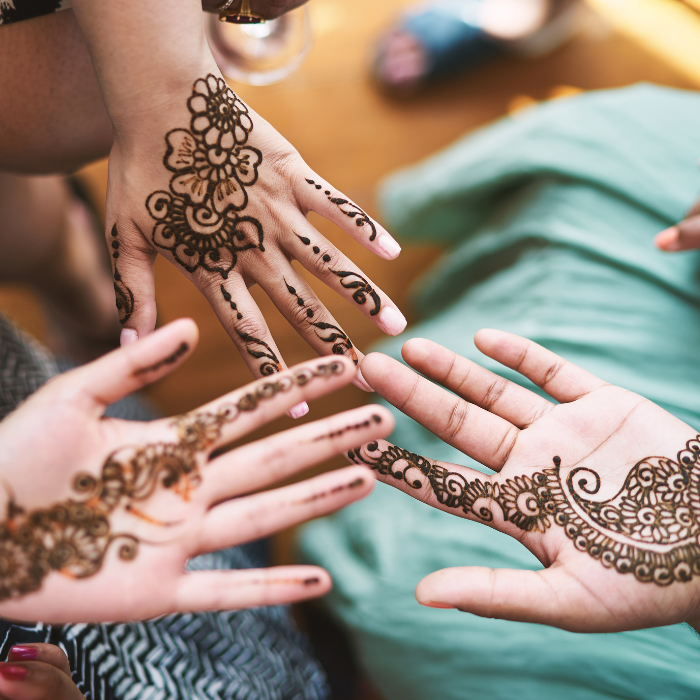 Hands showing off henna tattoo