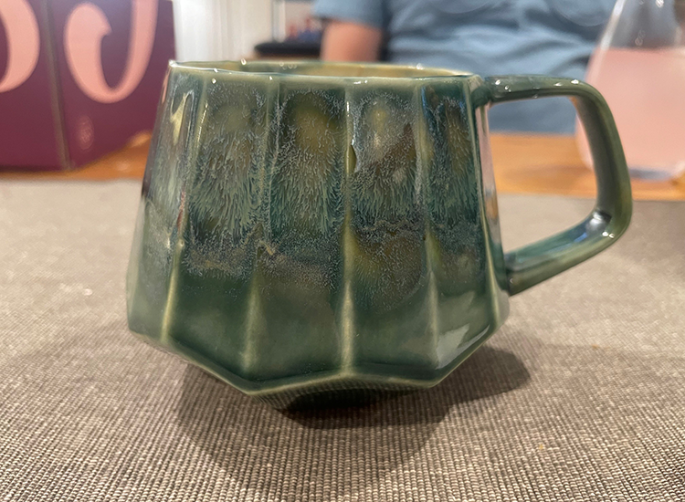 green ceramic coffee mug