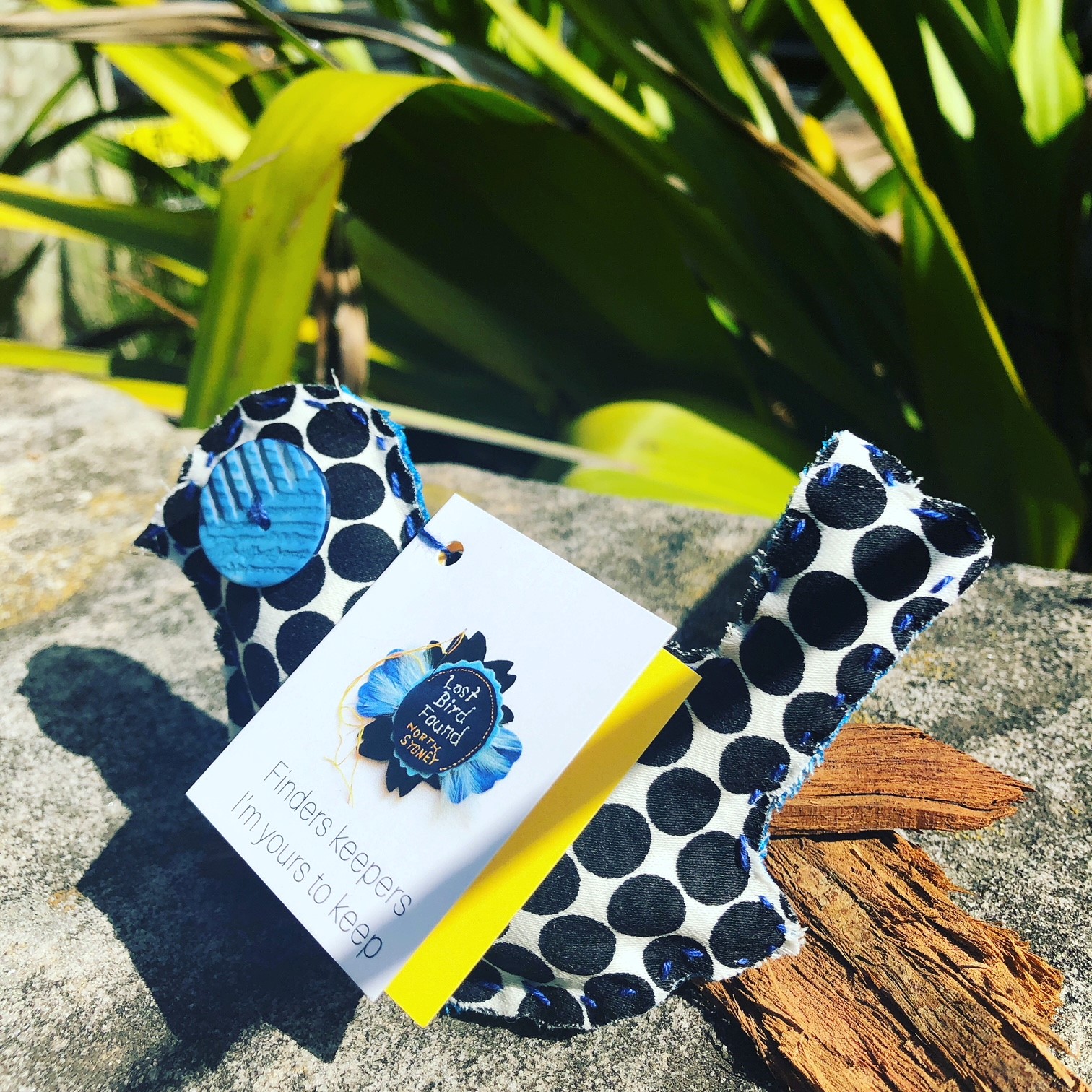 Cloth bird with Lost Bird Found tag on it