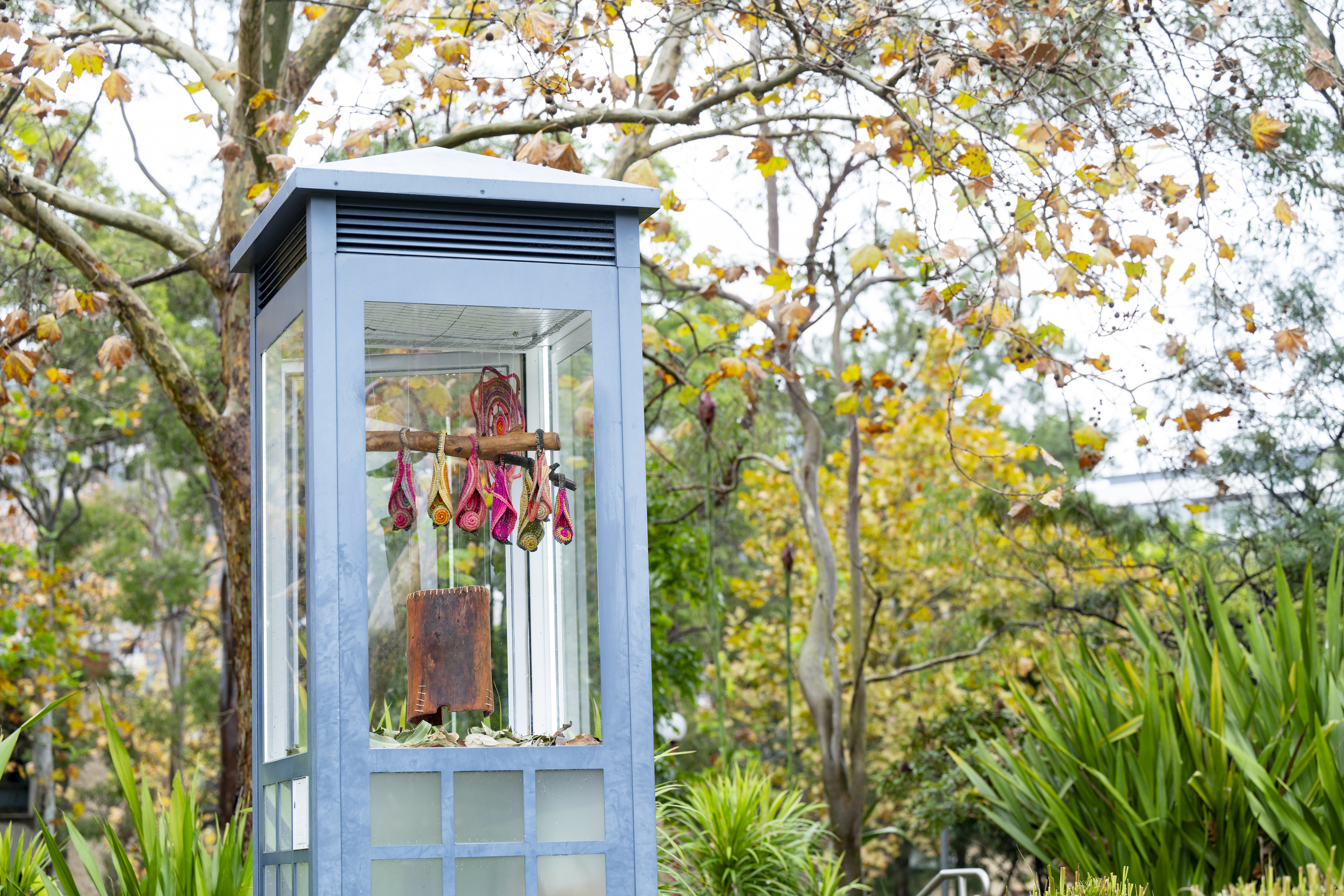 Display plinth in Ted Mack Civic Park with artwork by Virginia Keft, Weaving Sky Stories: Madjam nguna (Flying fox sleeping), 2025