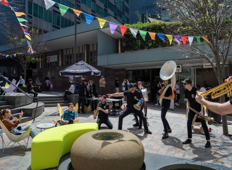 Band playing outside interacting with audience