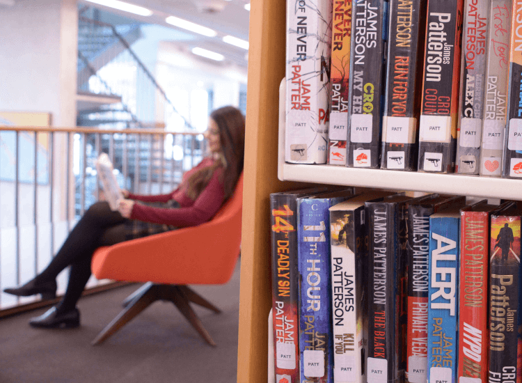 Woman reading in a library