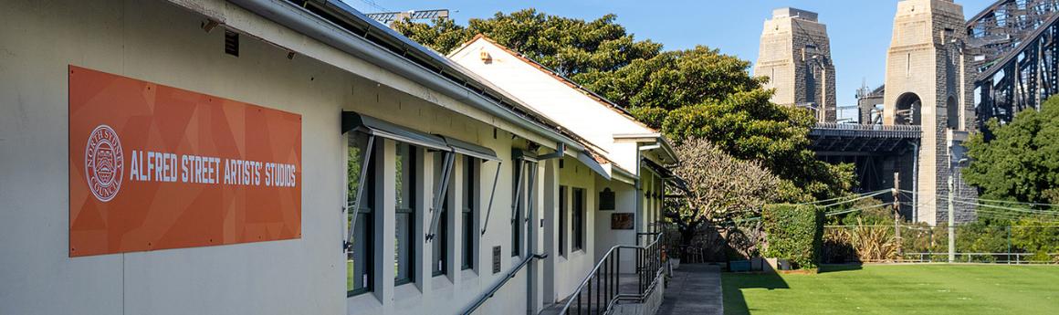 a building with the harbour bridge in the background
