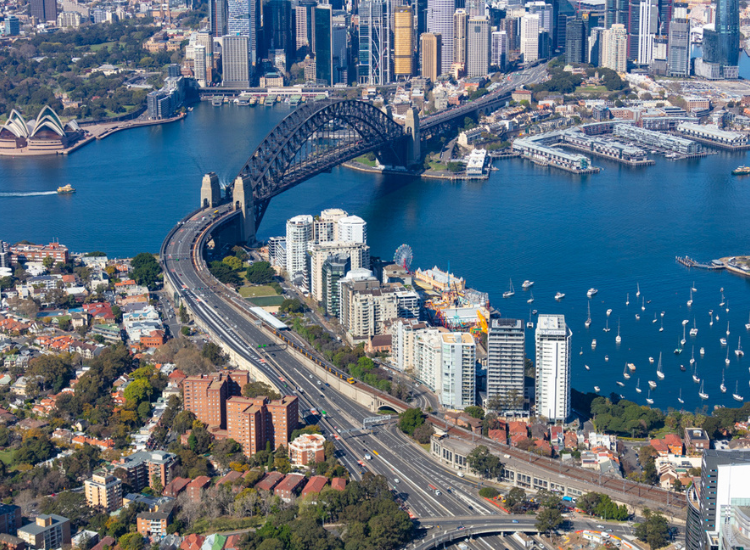 Aerial view of Sydney Harbour Bridge and city scape on either side