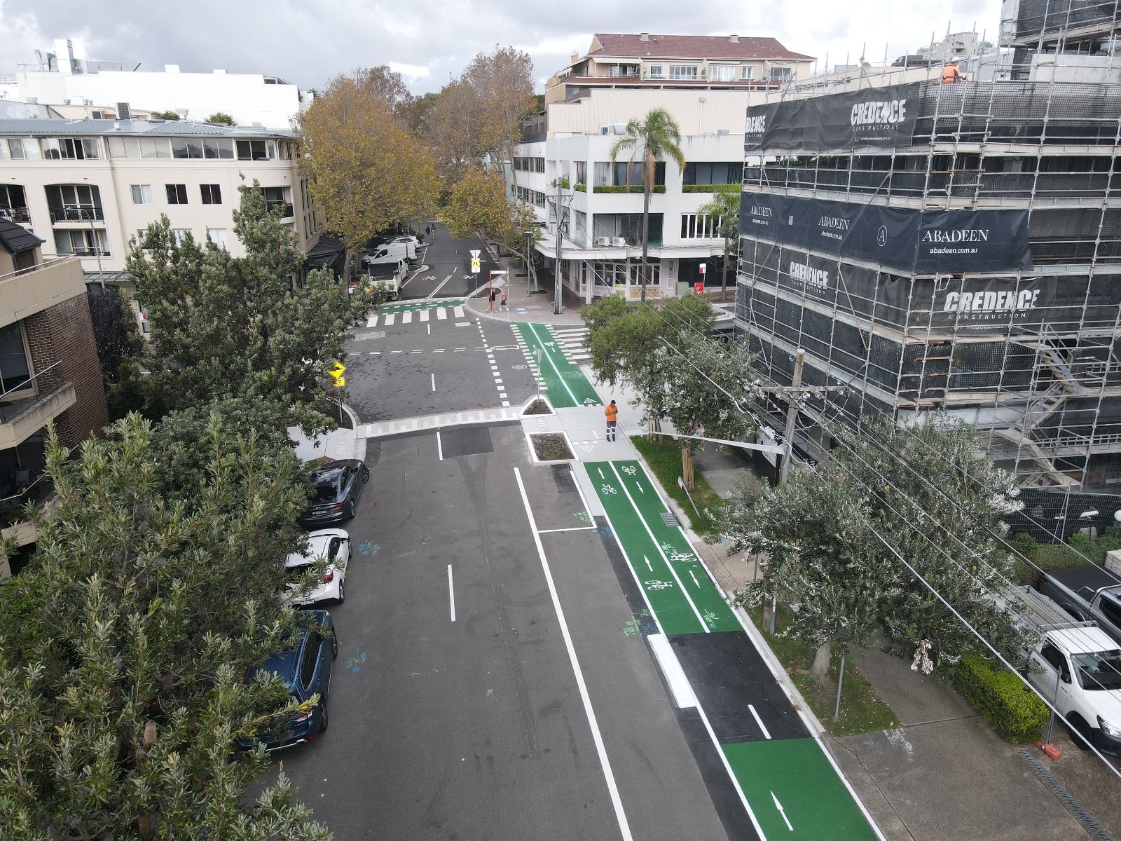 Aerial image of road with a green cycleway alongside it at Young and Grosvenor Street Intersection at Neutral Bay