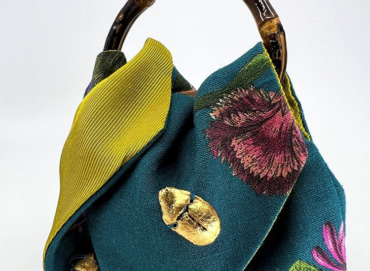 silk bag with circular wooden handle