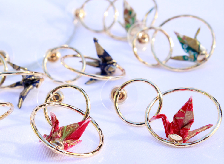 gold earrings with paper cranes
