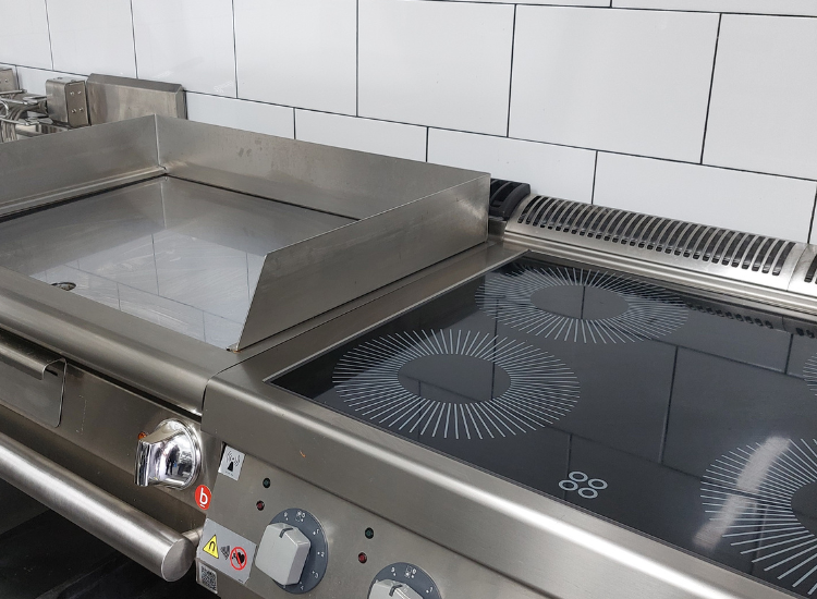 Image showing induction cooktop and electric appliances in a commercial kitchen