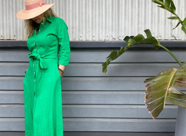 woman wearing green jumpsuit and straw hat