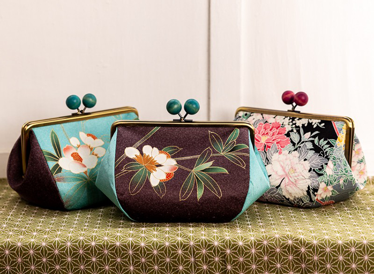 three purses with Japanese designs