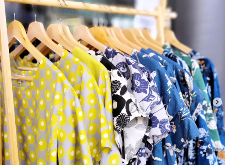 clothing wrack with various colourful t-shirts