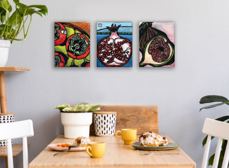 kitchen table with pot plants and art on wall behind